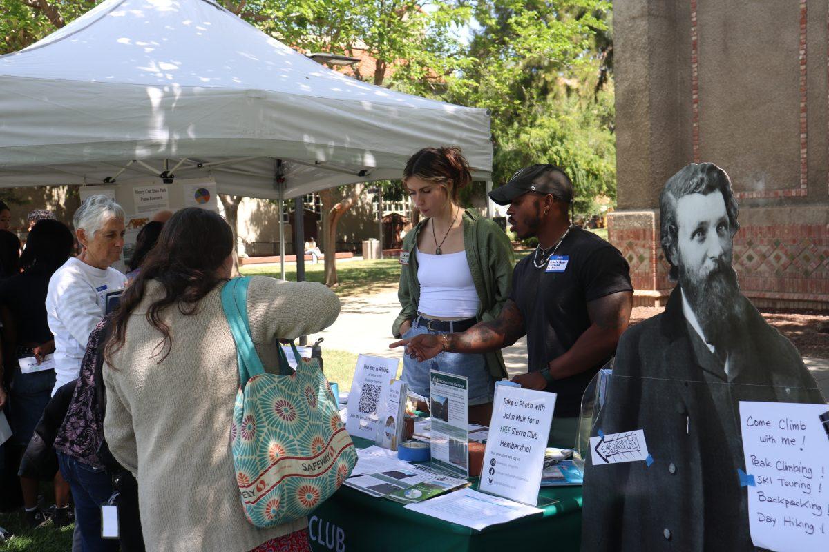 Jenna Haut (left), Bay Alive Campaign Assistant at Sierra Club Loma Prieta Chapter, and DeVant&#8217;e Dawson (right), postdoctoral researcher at Hopkins Marine Station of Stanford, speak to students and community members.
