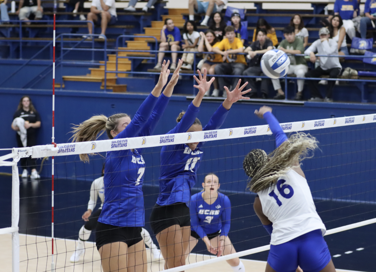 Spartan freshman outside hitter Morgan Graves leads with a spike against Gauchos' defense on Friday evening.