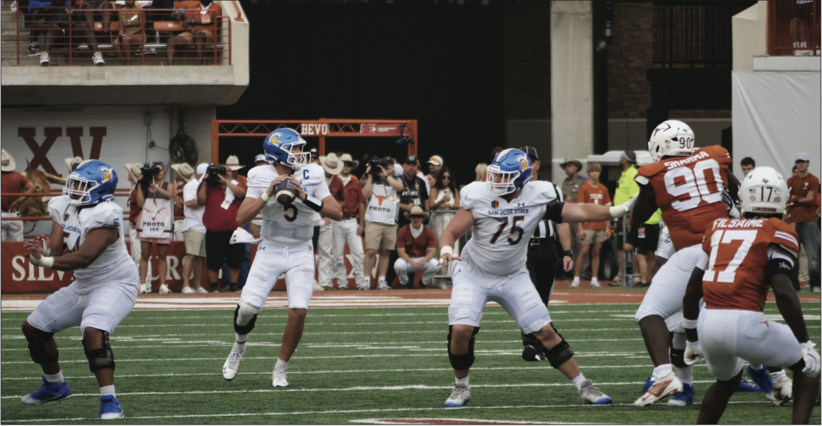 San José State quarterback Walker Eget (5) searches on the field for an open receiver downfield against No.7-ranked Texas in Austin.