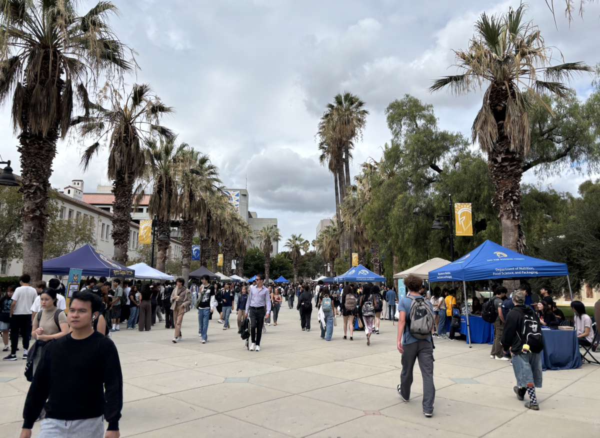 Students walk through Seventh Street Plaza viewing clubs and organizations at the Fall 2025 Student Organization Fair on Tuesday.