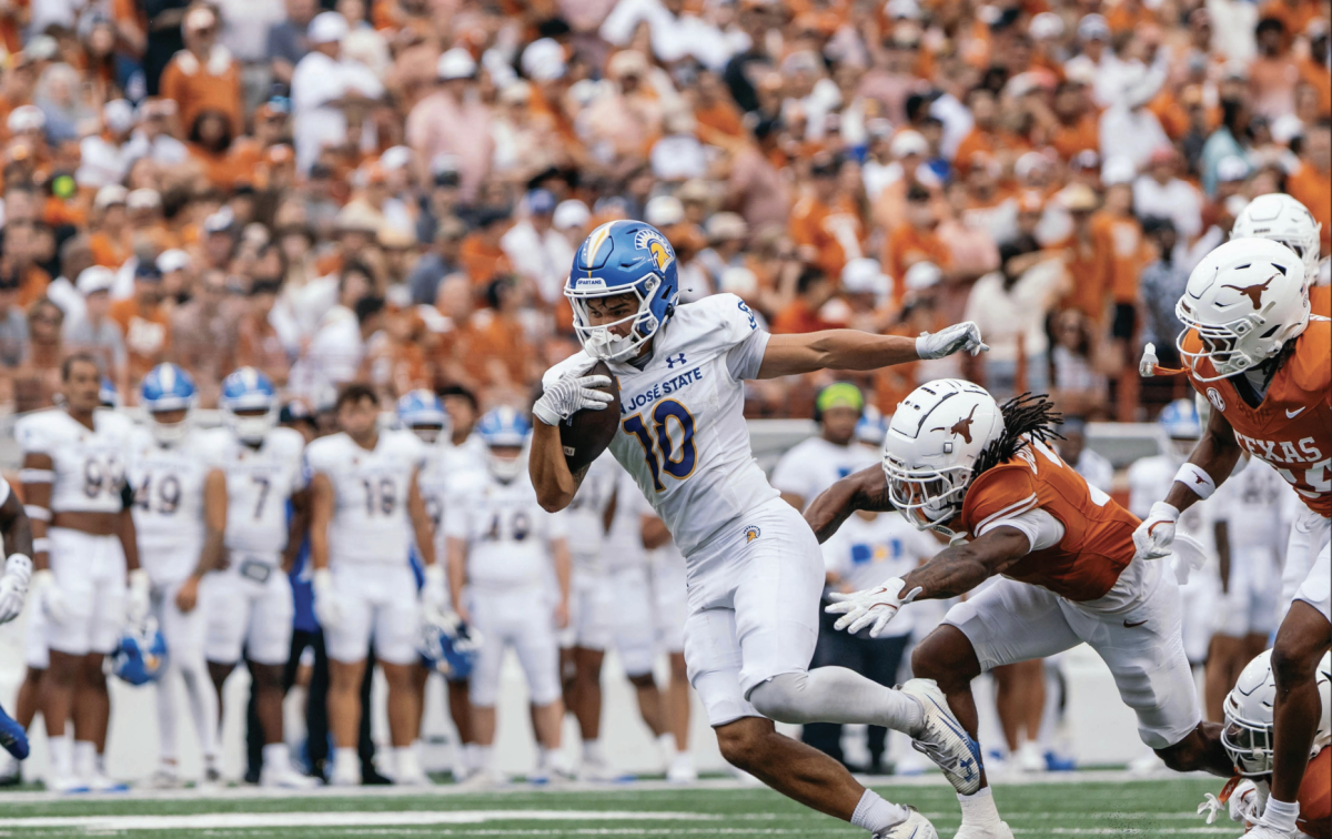 San José State wide receiver Danny Scudero (5) attempts to score against ranked-No.7 Texas at Darrell K Royal-Texas Memorial Stadium in Austin, Texas.