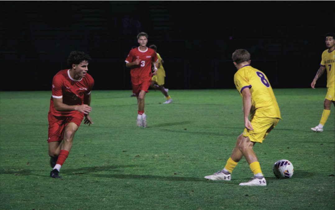 Spartan midfielder Cameron Cook (8) backtracks against the Matadors’ defense on Thursday night at home.