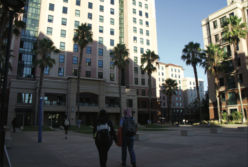 Students walk through Campus Village Courtyard on campus Monday evening.