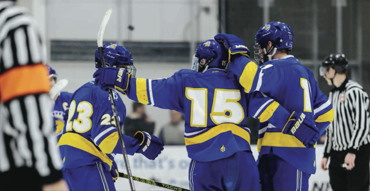 San José State Univerity Centers Kenneth Brown (23) and Felipe Castellanos (15) celebrates with teammates on the ice last season.