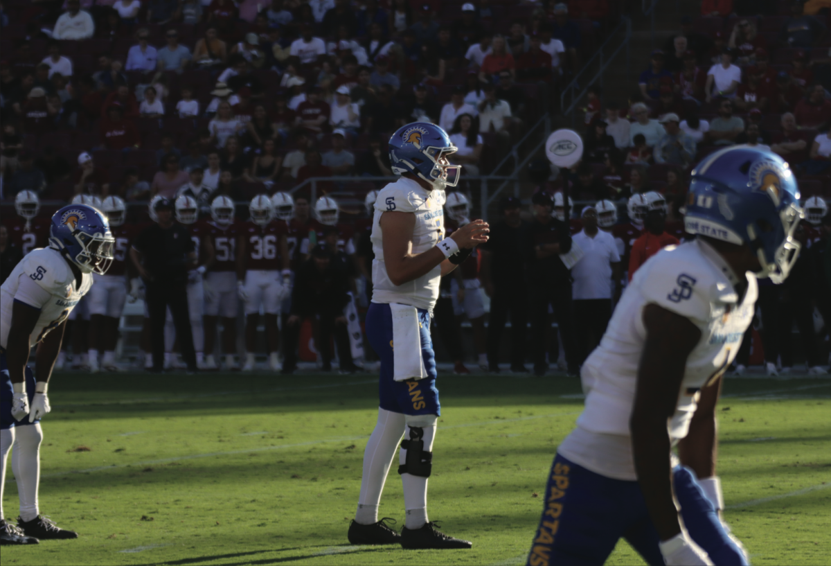 San José State University starting quarterback Walker Eget (5) prepares to take a snap against Stanford’s defense on Saturday. SJSU lost the game 30-29.