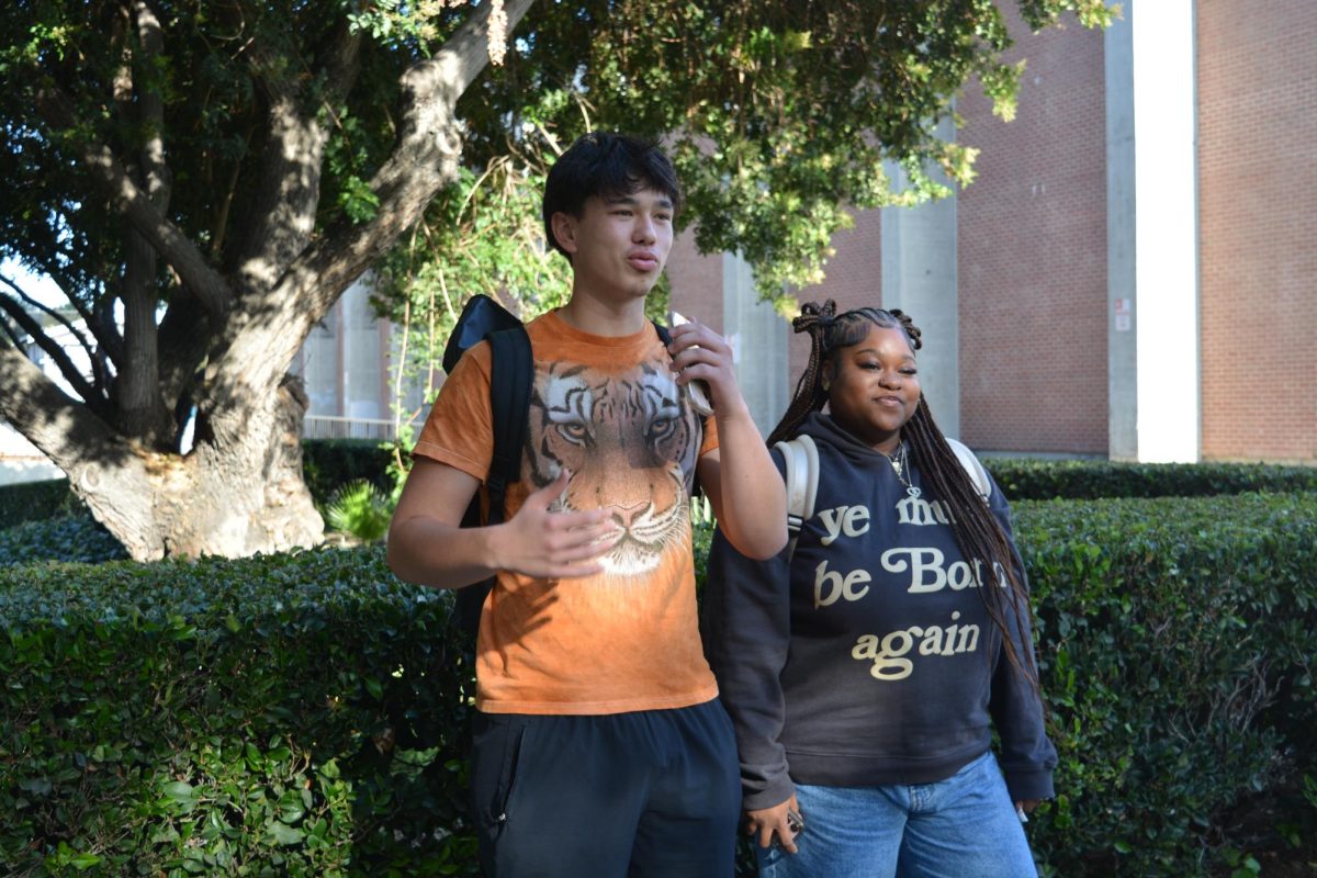Graduation Scope founder and SJSU student Elijah Keys (left) interviews Black Business Student Association President Kiaya Huff (right) about the platform.