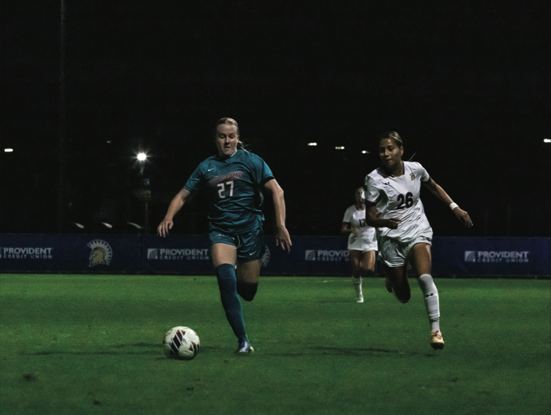 New Mexico defender Allie Anderson (27) and SJSU Foward Leslie Jacobo-Duran (26) chase down the ball Thursday.