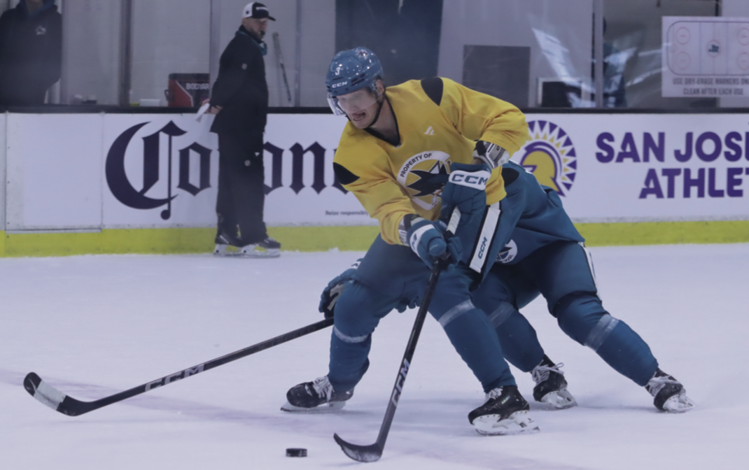 San José Sharks defenseman John Klingberg attempts to evade opponent at practice on Tuesday Sept. 30.