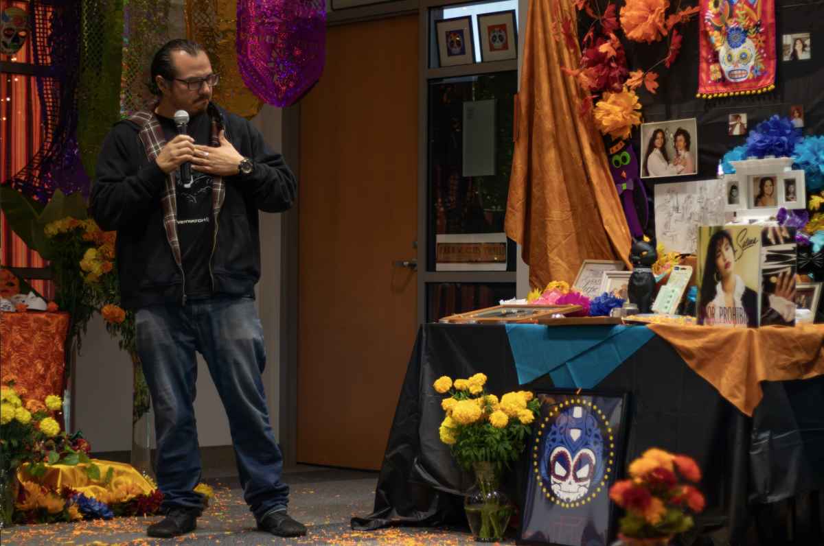 Enrique Jacobo, a local high school arts teacher, presents an ofrenda he created in memory of his mother.