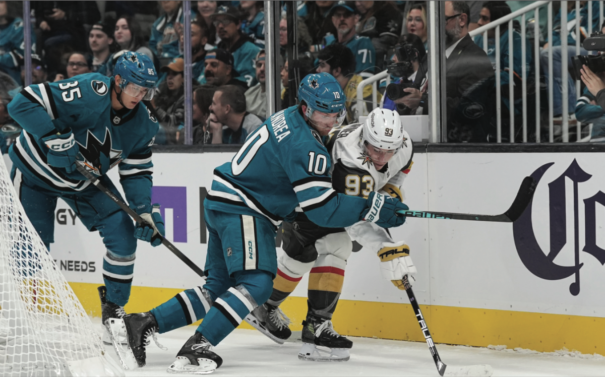 San José Sharks center Ty Dellandrea (10) defends against Vegas Golden Knights right winger Mitch Marner (93) Thursday night.