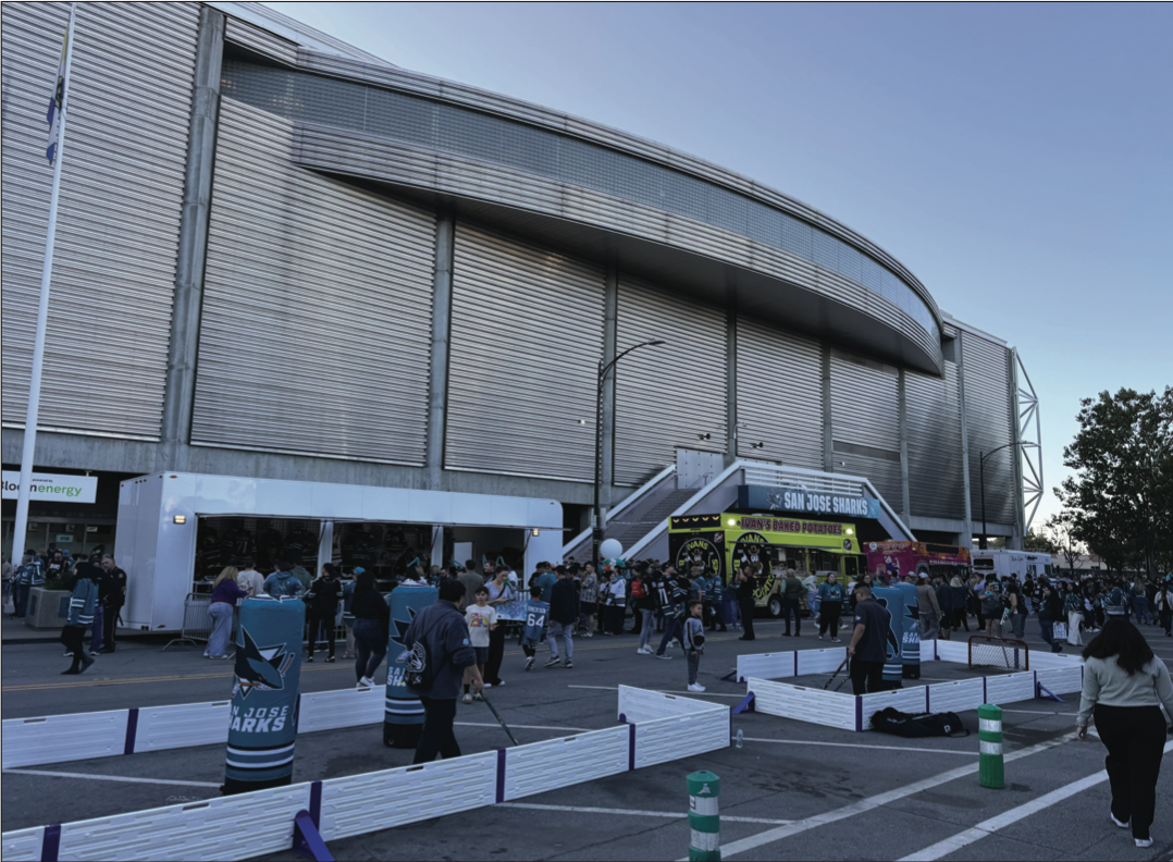 Plenty of Sharks fans gather outside of the SAP Center hours before opening night for various activities Thursday.