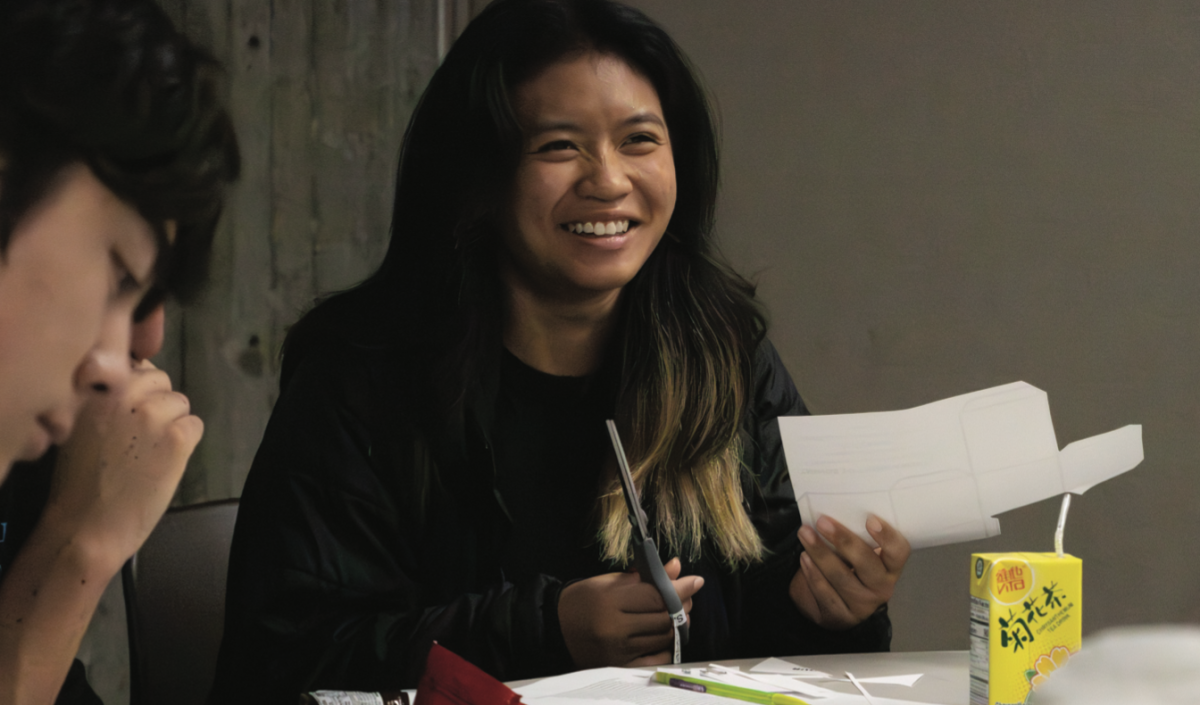 Ava Douangphachanh a fi rst-year mechanical engineering student, cuts a card stock mini-mural at the ‘Art as Resistance’ event on Thursday.