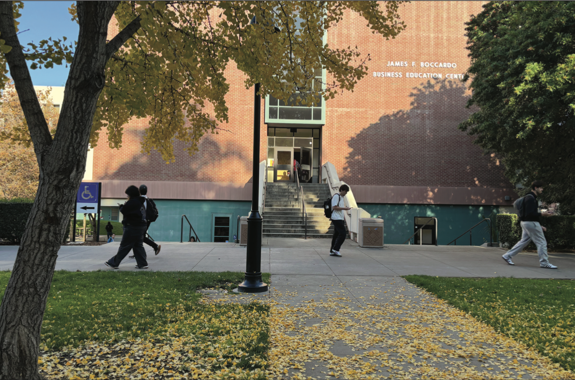 Students walk past the James E. Boccardo Business Education Center at SJSU on a fall afternoon.