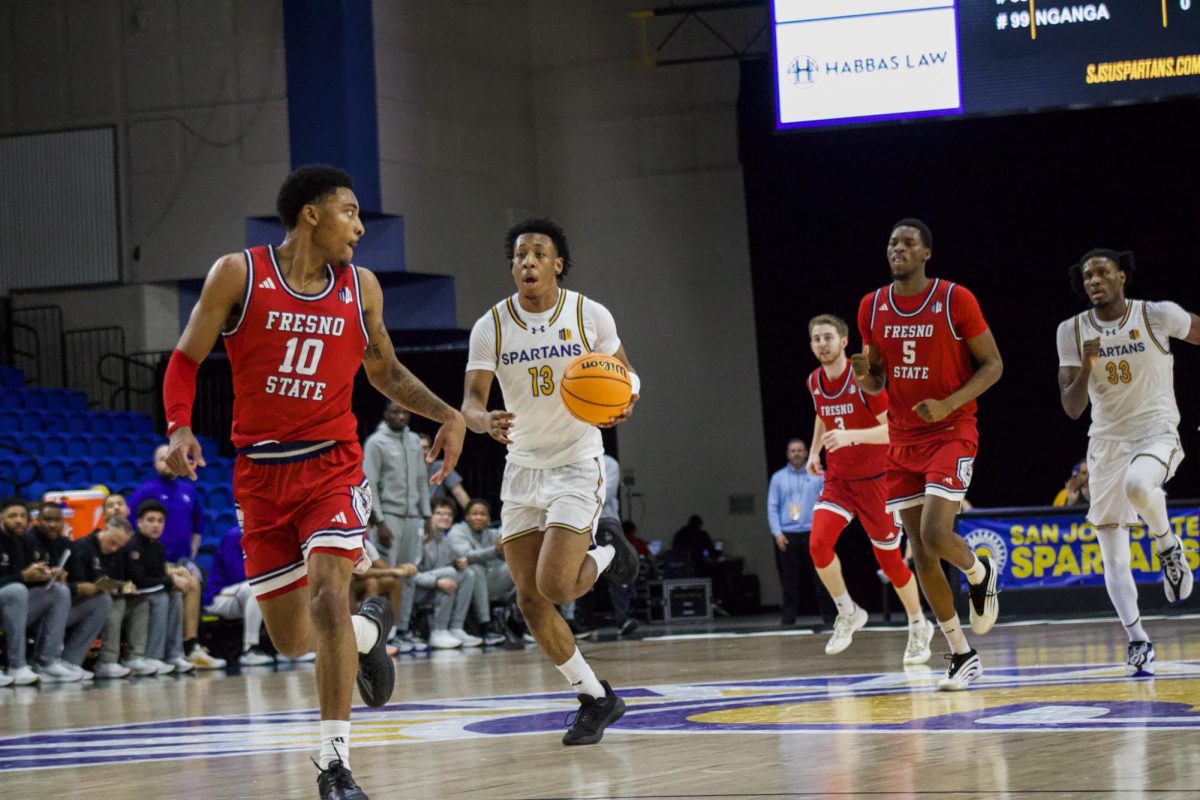 Sophomore guard Jermaine Washington brings the ball up the court during the Spartans' loss to the Bulldogs. 