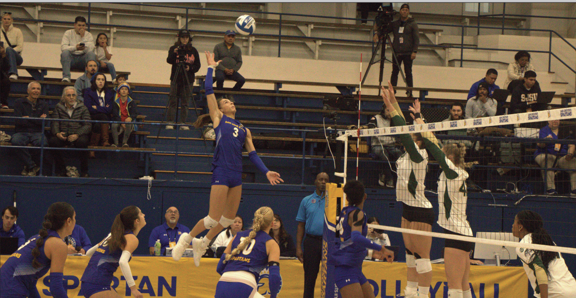 Former SJSU volleyball outside hitter Blaire Fleming jumps in attempt to score a point against the Colorado State Rams.