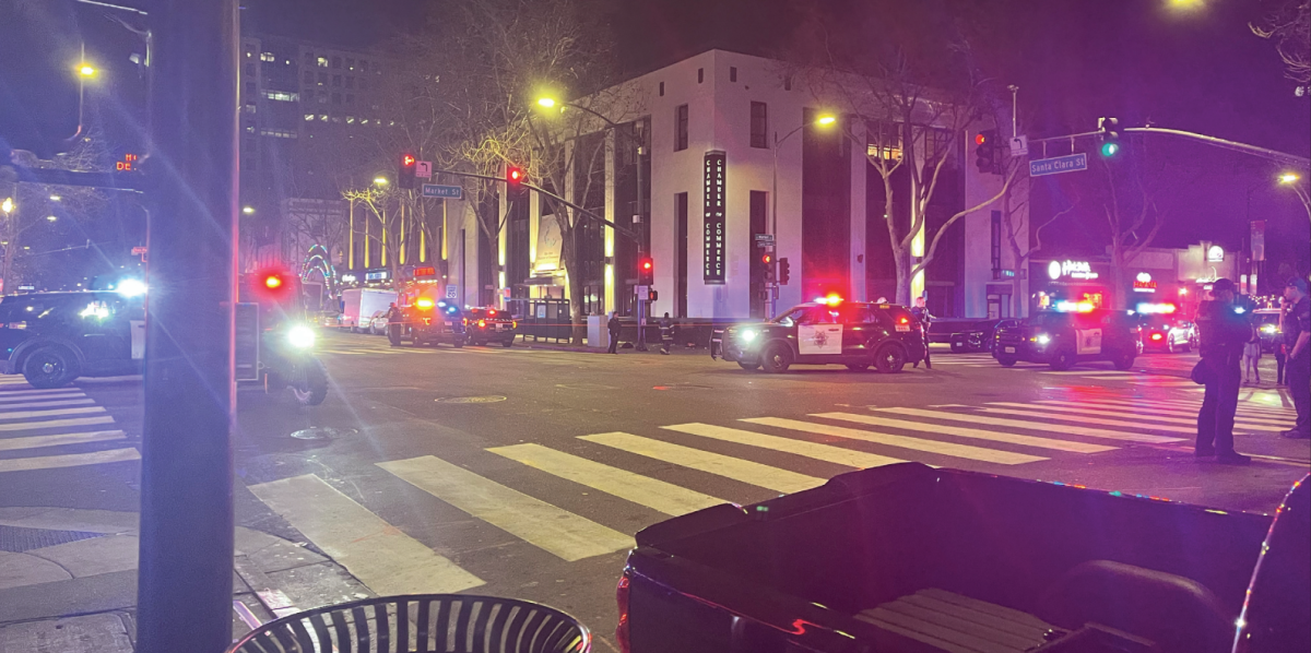 Police surround and block off the scene where five people were shot on Sunday night at the intersection of Santa Clara and Market streets.