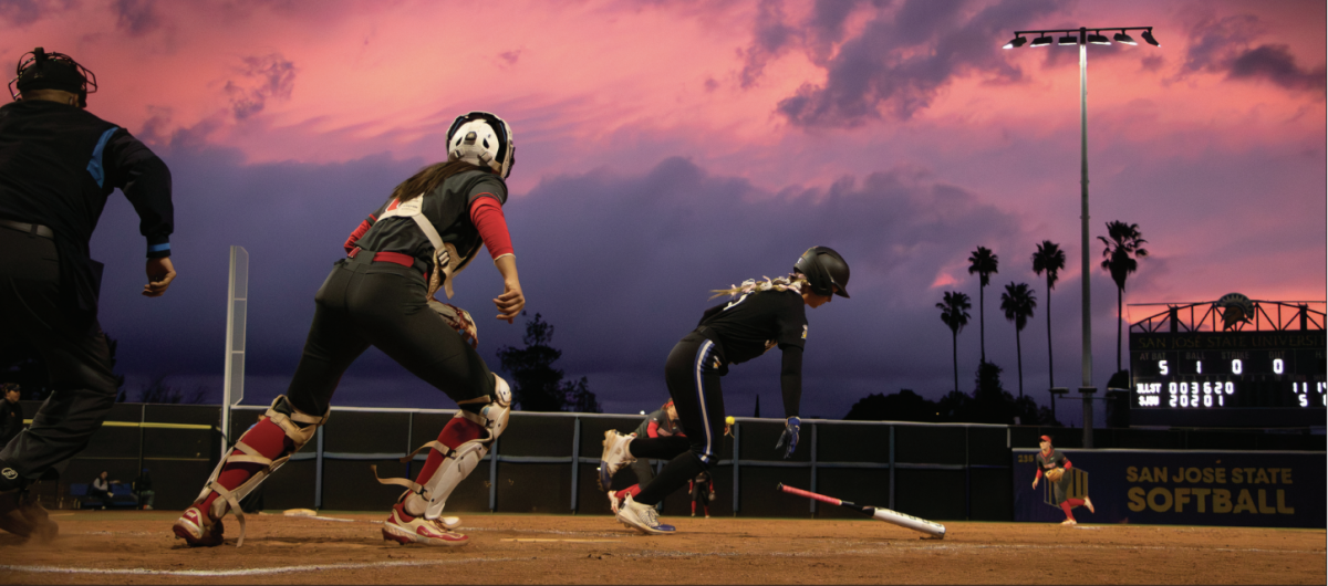 Senior utility player Shay McDowell heads to first after smacking a line drive to shortstop during a Valentine’s Day matchup that the Spartans lost 11-5.