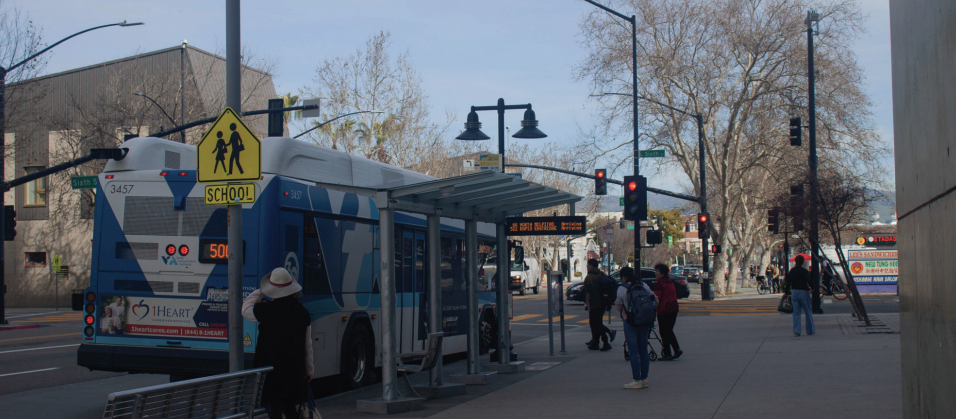 The Rapid 500 bus waits at a stop in front of City Hall before the intersection of East Santa Clara and Sixth streets.