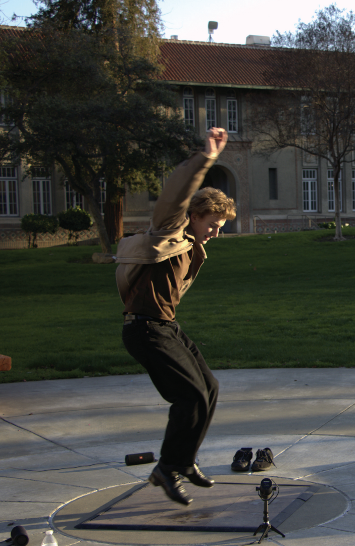 Riley Marshall, otherwise known as “SJSU tapman,” streams his tap dance performance in front of Clark Hall in the afternoon on Thursday.