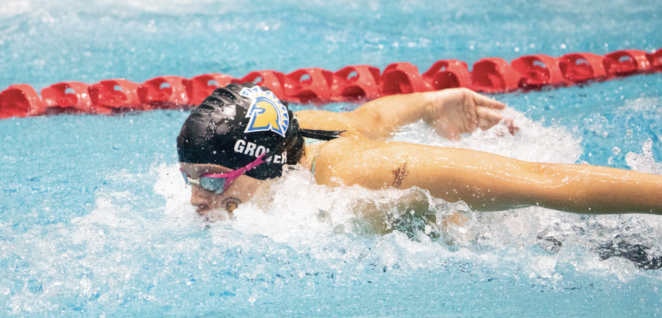 Freshman Lillie Grover competes in a butterfly stroke race during the Mountain West Championship.