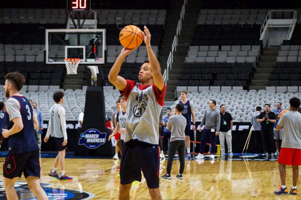 University of Arizona graduate student guard Evan Nelson puts up shots before practice at the SAP Center on Wednesday afternoon.