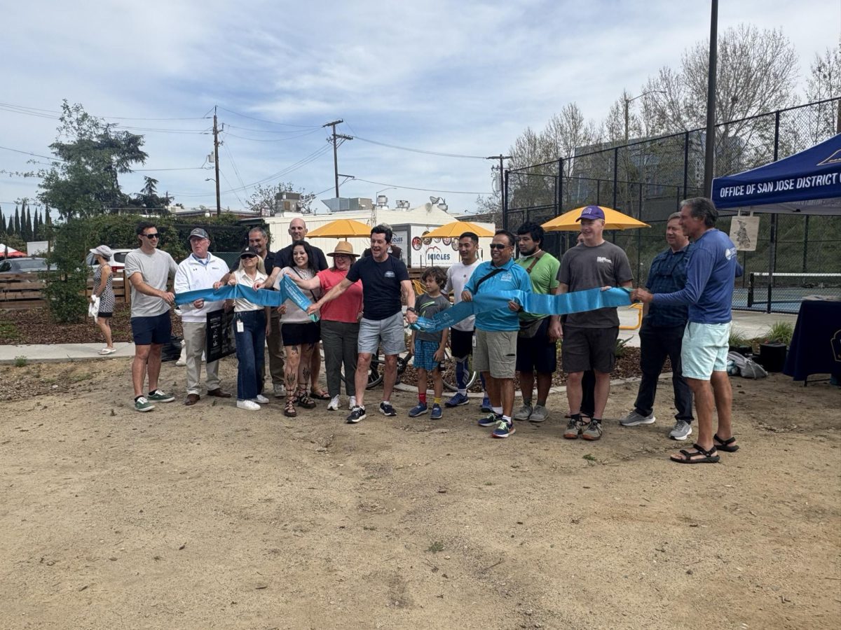 City officials and community members gather for a ribbon cutting ceremony celebrating the renovations at Guadalupe River Park on Sunday in San José.
