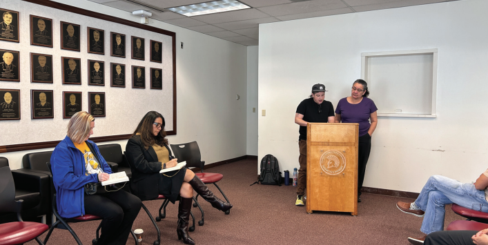 Speakers take to the podium in front of the SJSU Associate Vice President Heather French and Associate Vice President Rachel Camacho during the TransTalk Town Hall meeting.