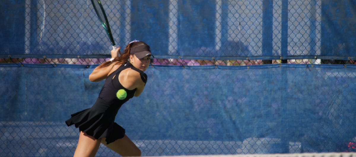 Freshman Tara Mihaljevic prepares to smack the ball back during her match on Thursday. Mihaljevic lost her singles match 6-2, 6-2, in straight sets.