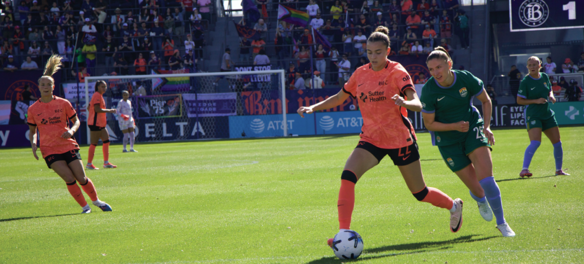 Defender for Bay FC Brooklyn Courtnall (22) drives forward while being tailed by Denver Summit FC forward Melissa Kössler. Bay FC won the match 2-1 on Saturday.