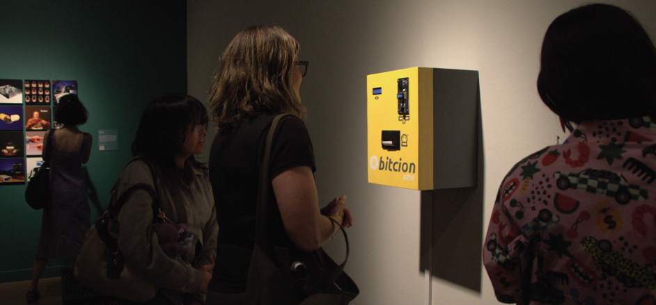 Mel Day, an artist and attendee, gazing at a Bitcoin interactive art piece displayed on Tuesday.
