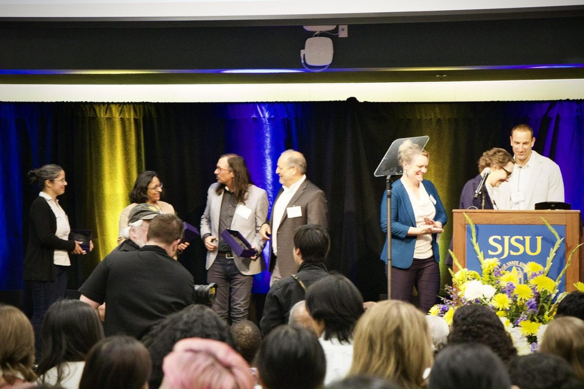 Faculty researchers Jessica Castillo-Vardaro, Sudha Krishnan and Craig B.
Clements receive their awards on stage during SJSU Research Week.