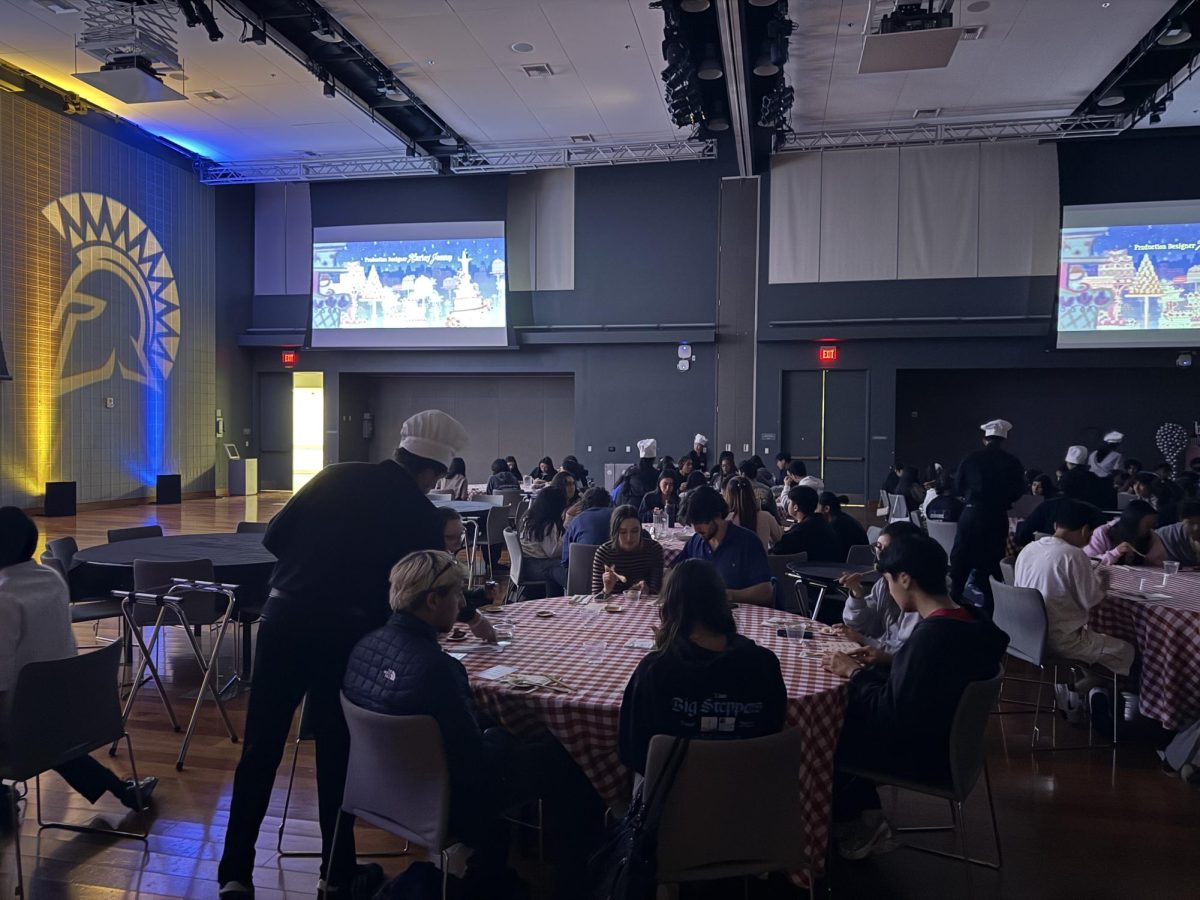 Students watch Ratatouille (2007) at the Fork and Film event hosted by the Student Union Events and Programs team in the Student Union Ballroom.