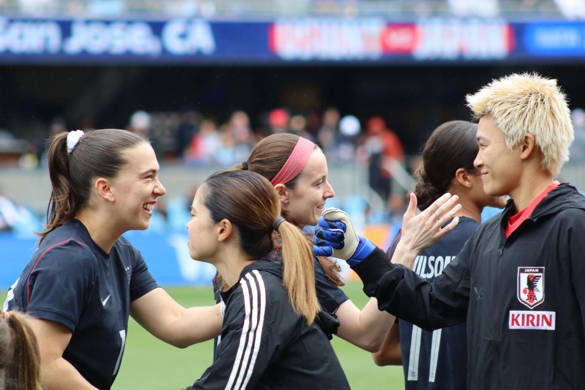 Players on the Japan national football team shake hands with members of Team USA on Saturday. USA bested Japan 2-1 in an international match at Paypal Park.