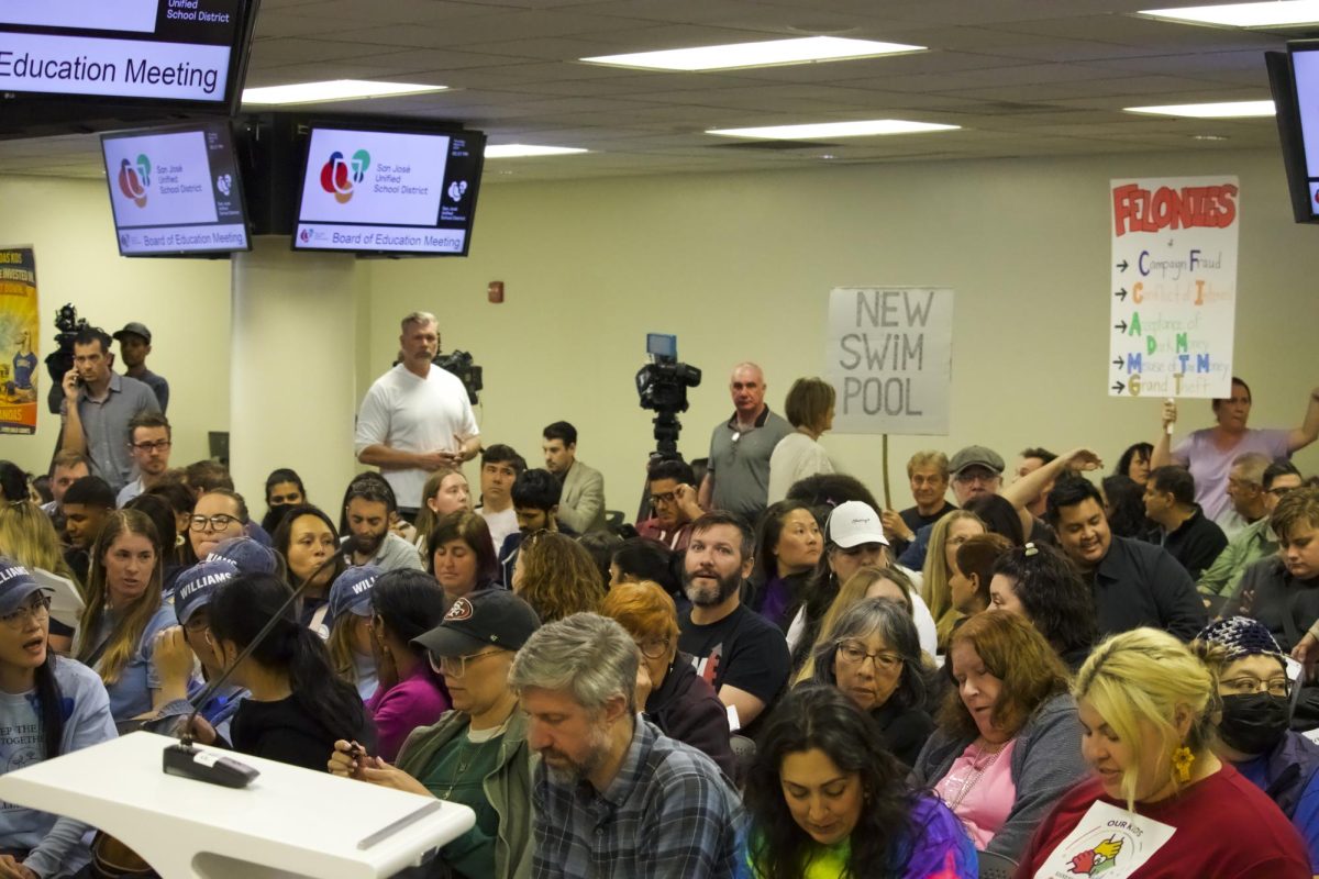 Families and community members gather inside the San José Unified School District (SJUSD) office building to protest against school closures on March 26.