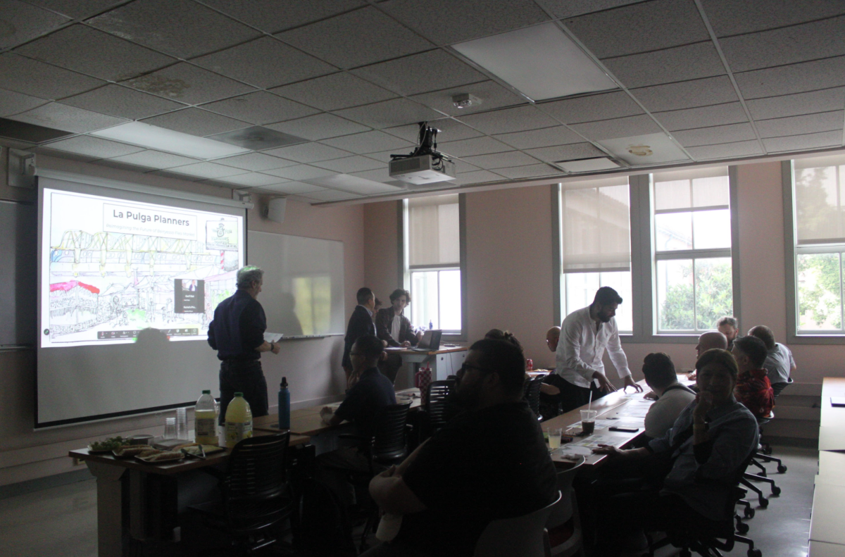 Urban planning graduate students set up before presenting their capstone projects centered around the San José Berryessa Flea Market on March 26.