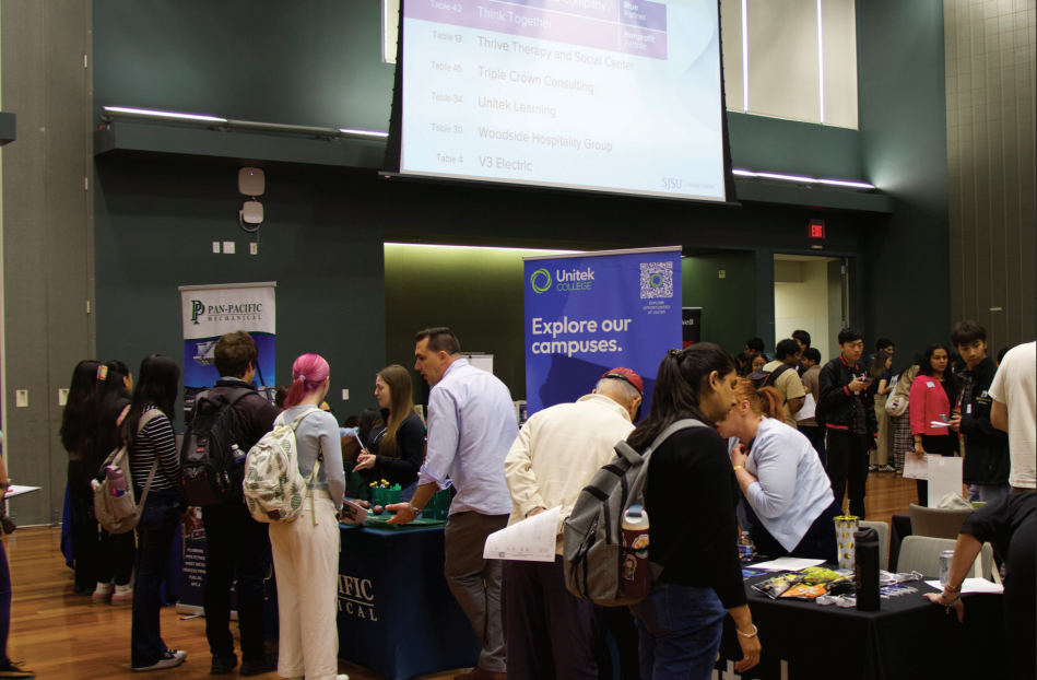 Students talk to recruiters at the Late Spring Job and Internship Fair at the Student Union Ballroom on Tuesday. 
