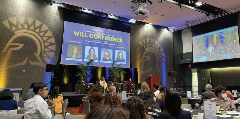 Women in Leadership panelists listen to an audience question as students, mentors and alums sit in the Student Union.