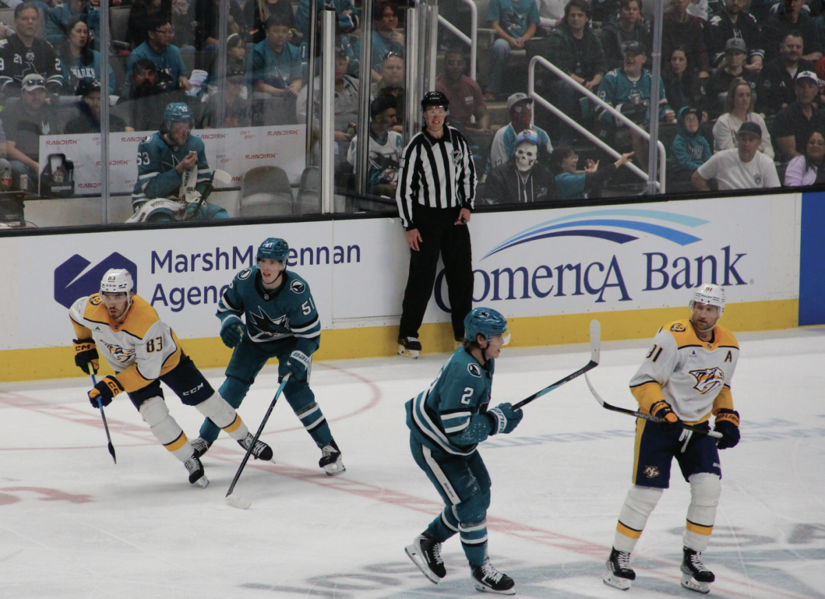 Right-winger Collin Graf (51) and center Will Smith (2) play defense at mid-ice. Smith finished second on the team in scoring with 24 goals in 69 games played this season.