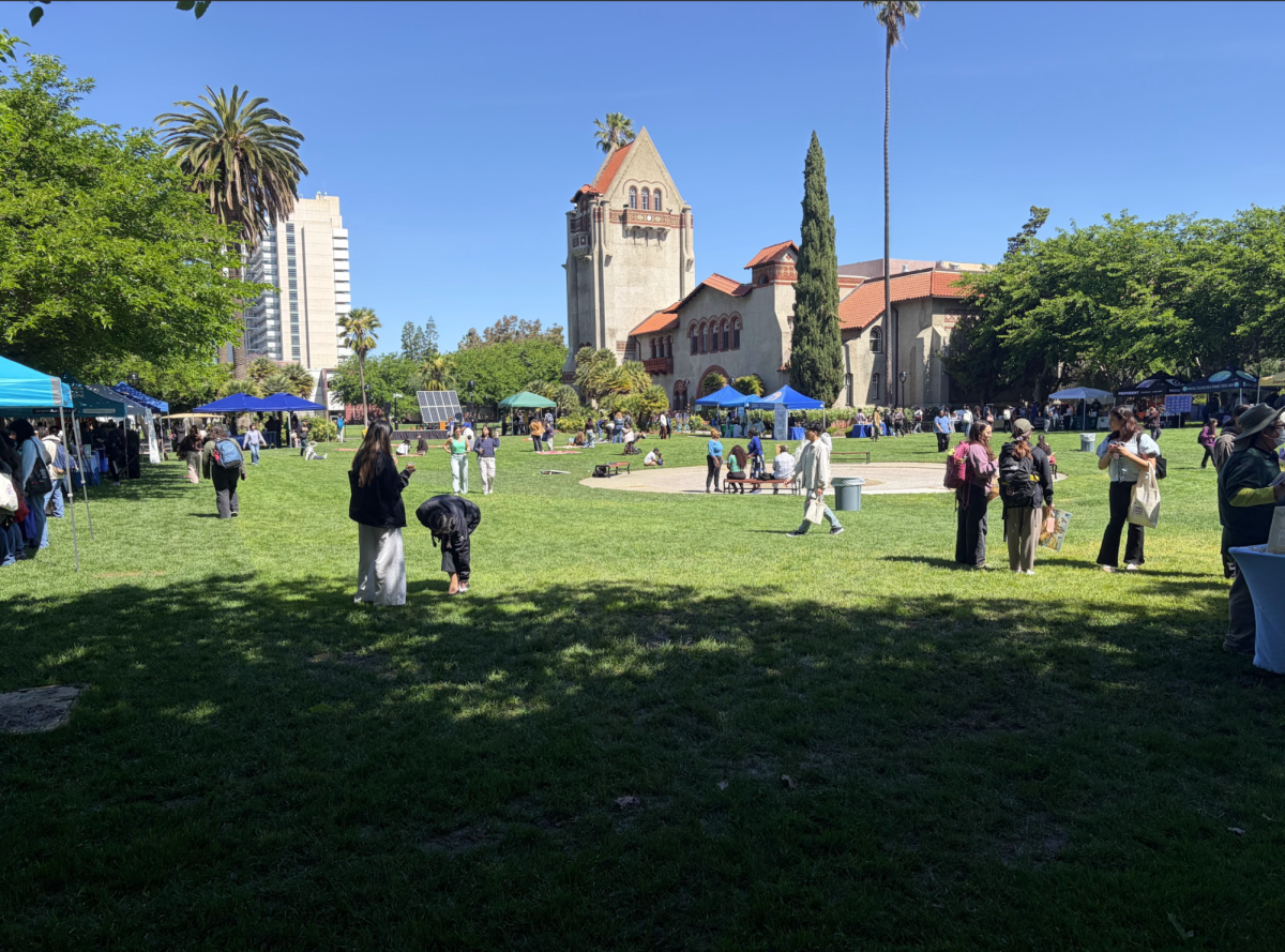 Students gather on Tower Lawn at San José State for the Environmental Resource Center Earth Day celebration event on Thursday.