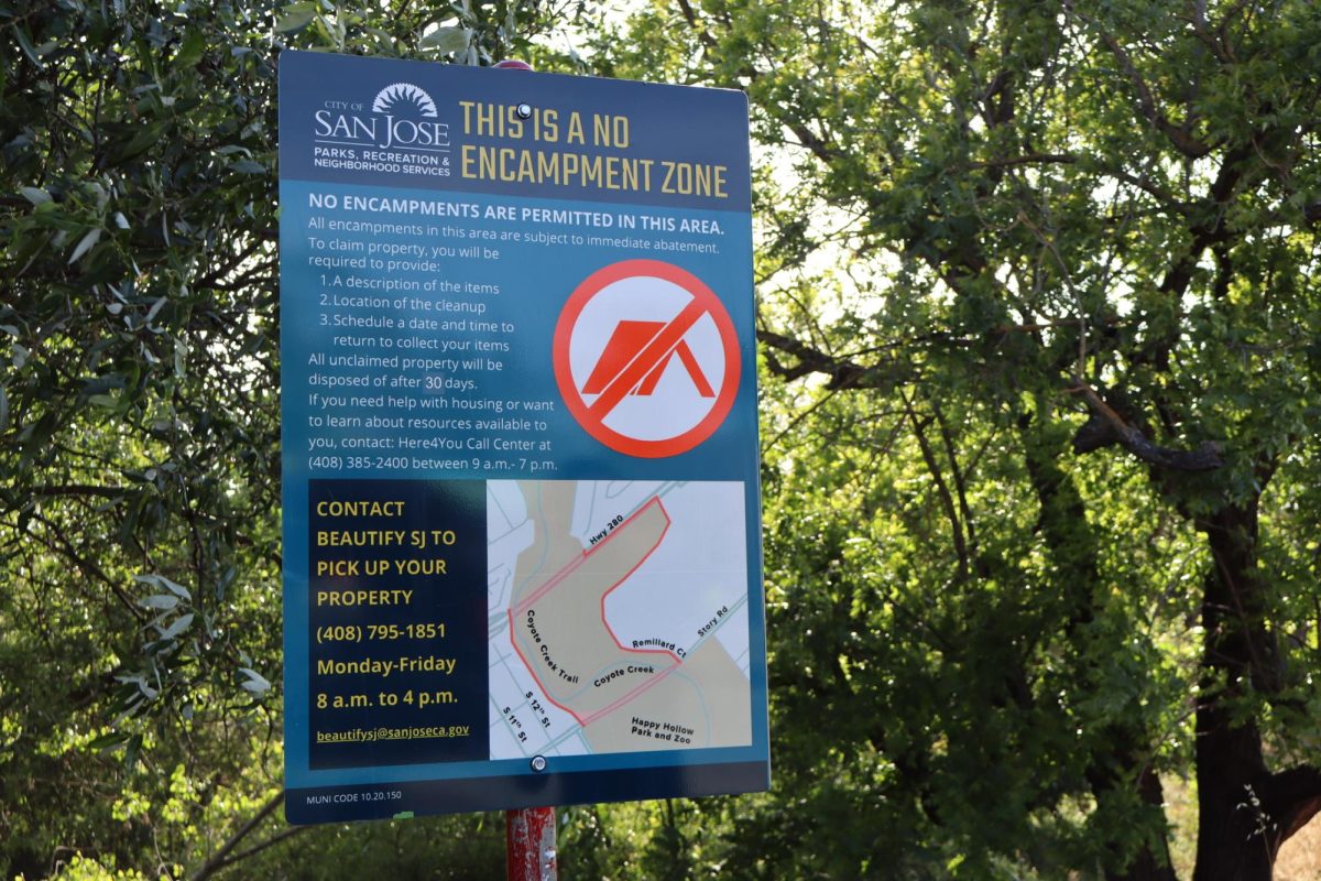 A sign posted at Coyote Creek provides instructions for residents to claim their property after encampment sweeps.