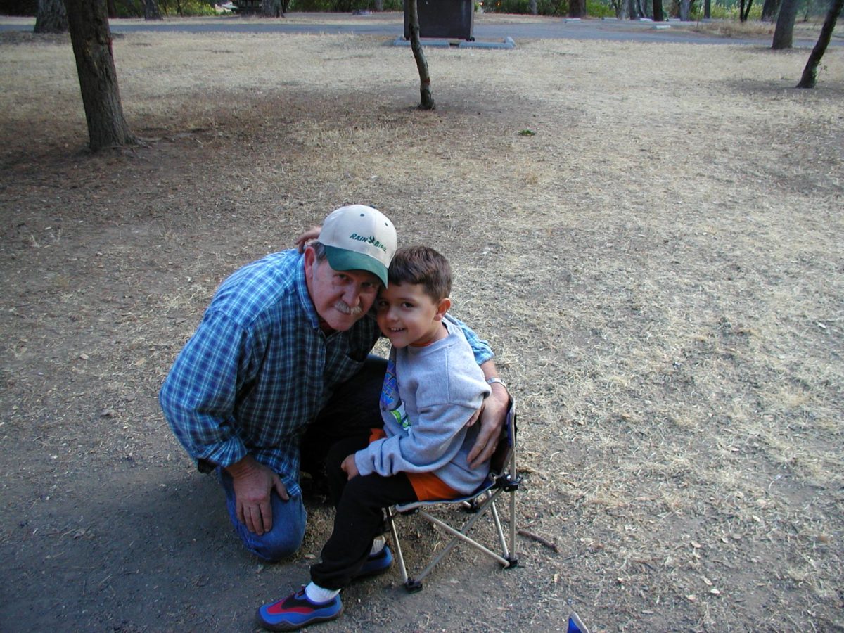 Zachary Winters (right) with his grandfather, George Winters, pose for a picture on a camping trip in 2004.