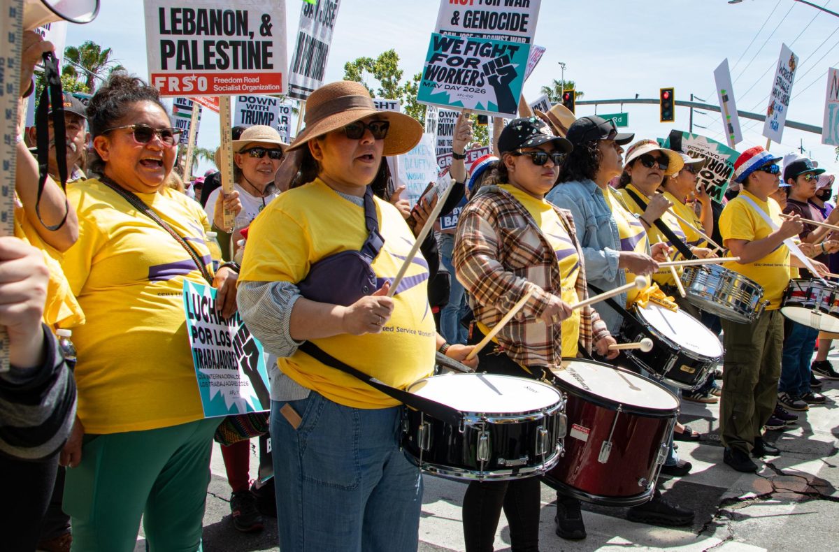 Members of Service Employees International Union-United Service Workers West, which represents janitors, security officers and airport service workers, stand in a drum line at Friday’s May Day Protest in East San José.
