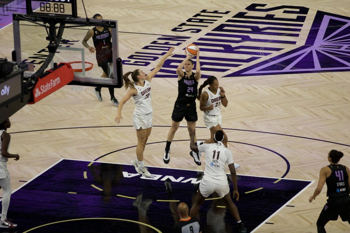 Valkyries forward Cecilia Zandalasini attempts a jumper from the free-throw line while guarded by Dream rookie guard Isobel Borlase.